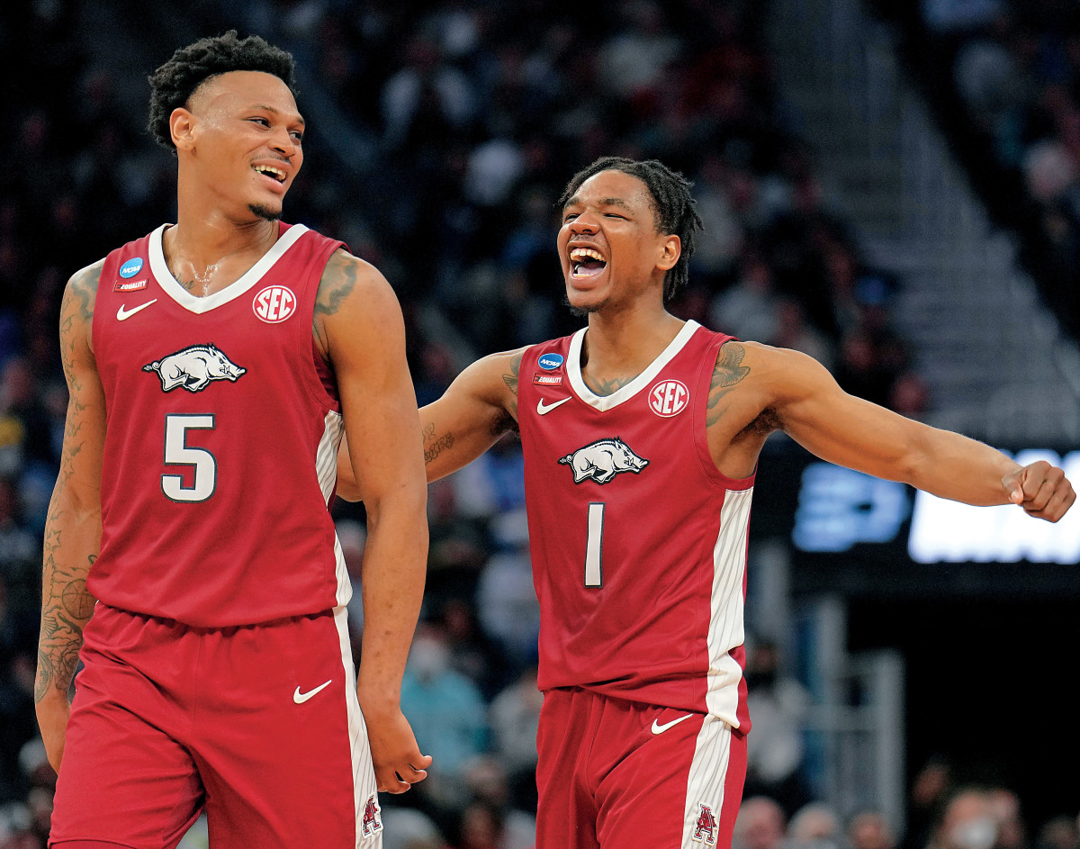Arkansas Razorbacks guards Au'Diese Toney (5) and JD Notae (1) celebrate after a powerful block by Toney against the Gonzaga Bulldogs late during the second half in the semifinals of the West regional of the men's college basketball NCAA Tournament at Chase Center. The Arkansas Razorbacks won 74-68.